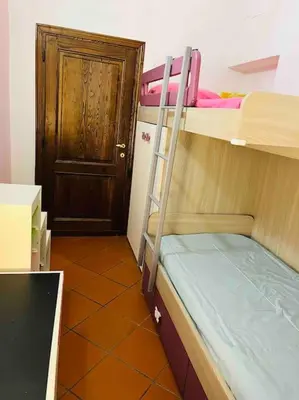 Letto o letti in una camera di Casa Maria