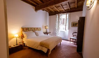 Letto o letti in una camera di Acacia Firenze - Adelfa