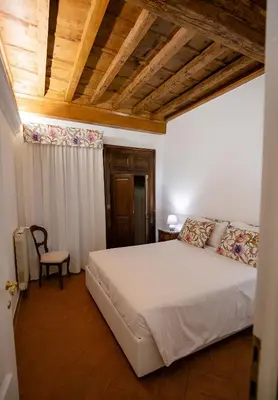 Letto o letti in una camera di Acacia Firenze - Adelfa