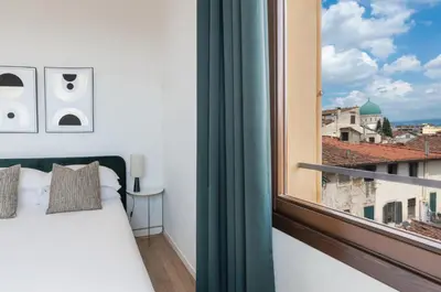 Letto o letti in una camera di Apartments Florence- Borgo Pinti Panorama