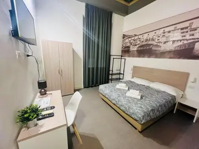 Letto o letti in una camera di Sant Antonino First Floor Relais