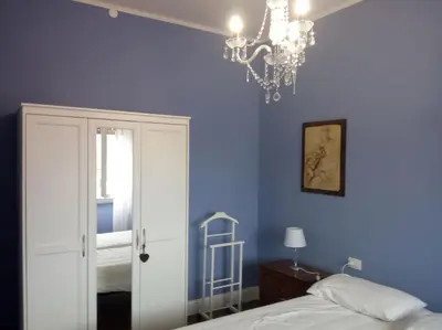Letto o letti in una camera di AL FRASCATI, Centro Storico