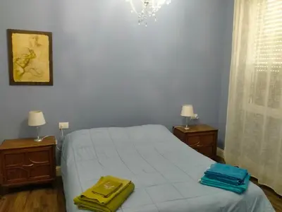 Letto o letti in una camera di AL FRASCATI, Centro Storico