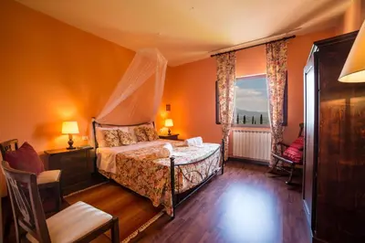 Letto o letti in una camera di Fattoria Pagnana Suites & Pool
