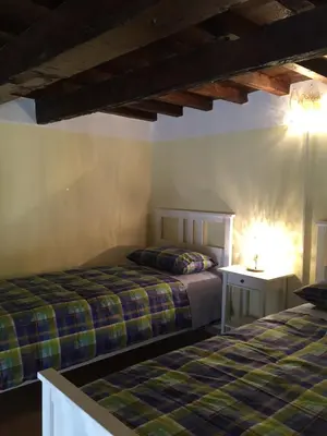 Letto o letti in una camera di LA CASA DI ORSOLA