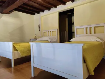 Letto o letti in una camera di LA CASA DI ORSOLA
