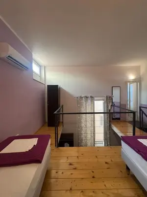 Letto o letti in una camera di Emerald Palace