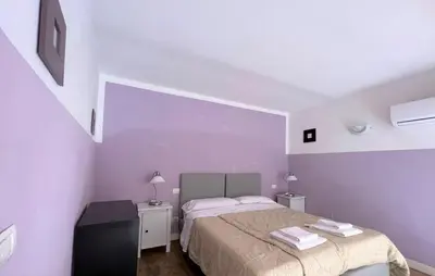 Letto o letti in una camera di Emerald Palace