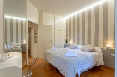 Letto o letti in una camera di La Perla Del Borgo Apartment