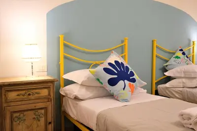 Letto o letti in una camera di Wine Apartments Florence Nebbiolo