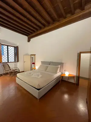 Letto o letti in una camera di At the Boboli Garden Carola Loft