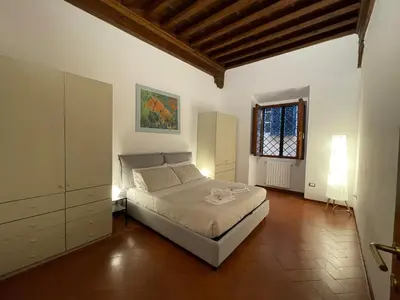 Letto o letti in una camera di At the Boboli Garden Carola Loft