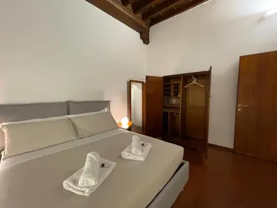 Letto o letti in una camera di At the Boboli Garden Carola Loft