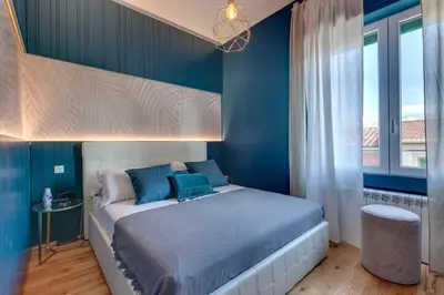 Letto o letti in una camera di Guido Monaco Apartment by Mamo Florence