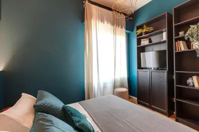 Letto o letti in una camera di Guido Monaco Apartment by Mamo Florence