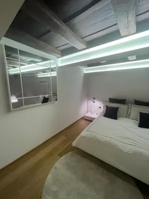 Letto o letti in una camera di Elegante appartamento Borgo San Jacopo