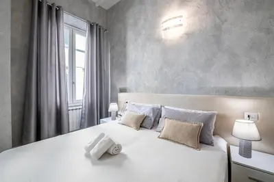 Letto o letti in una camera di [5 Minuti - Duomo] Tripla Suite Luxury