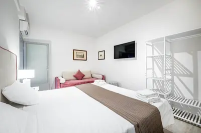 Letto o letti in una camera di YID Donatello con terrazzo