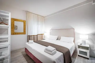 Letto o letti in una camera di YID Donatello con terrazzo