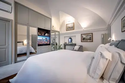 Letto o letti in una camera di Dimora Collection - Le Corti - Boutique Luxury Suites in a Restored 13th Century Convent, with Sauna and Gym