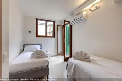 Letto o letti in una camera di Don Minzoni District Apartments by Mamo Florence