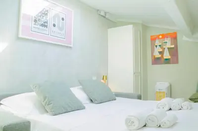 Letto o letti in una camera di Alighieri Boutique Apartment