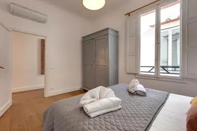 Letto o letti in una camera di Il Prato Apartment by Mamo Florence