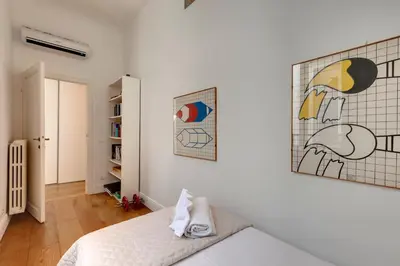 Letto o letti in una camera di Il Prato Apartment by Mamo Florence