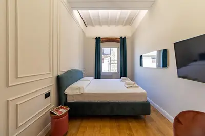 Letto o letti in una camera di Leovinci Rooms