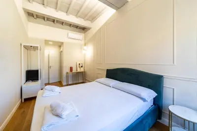 Letto o letti in una camera di Leovinci Rooms