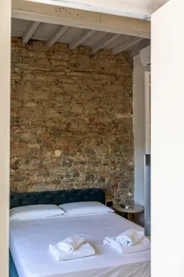 Letto o letti in una camera di Leovinci Rooms