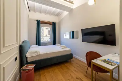 Letto o letti in una camera di Leovinci Rooms