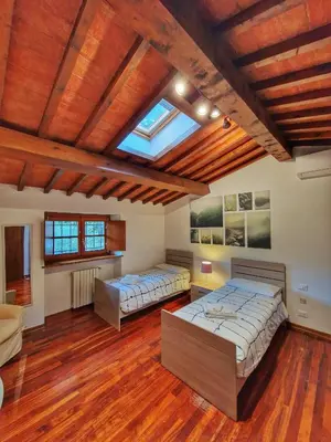Letto o letti in una camera di Villa Castaldi Firenze vicina al centro