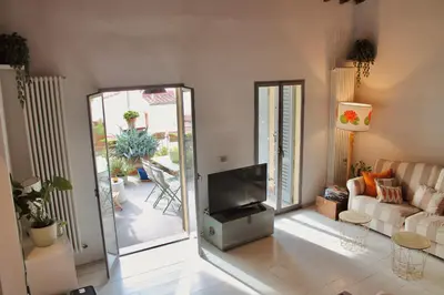 Area soggiorno di Attico con terrazza su Firenze