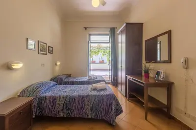 Letto o letti in una camera di Foresteria Valdese di Firenze
