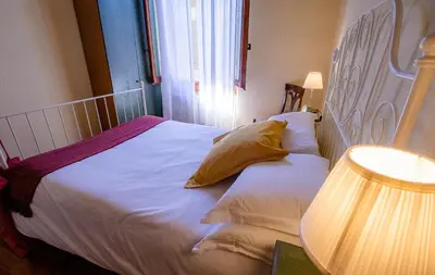 Letto o letti in una camera di Acacia Firenze -Tulipano