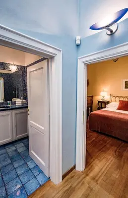 Letto o letti in una camera di Acacia Firenze -Tulipano