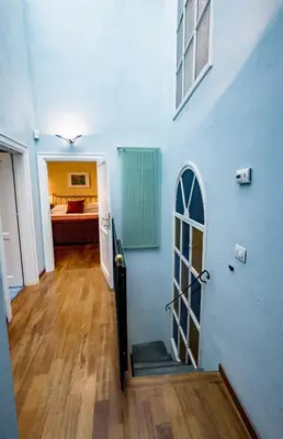 Letto o letti in una camera di Acacia Firenze -Tulipano