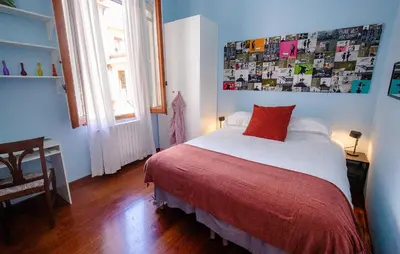 Letto o letti in una camera di Acacia Firenze -Tulipano