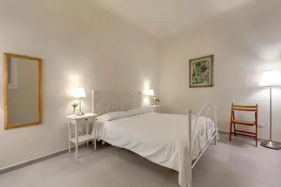 Letto o letti in una camera di Civico 5 Florence - Silenzioso appartamento nel cuore di Firenze San Lorenzo