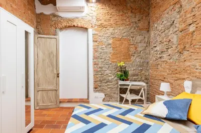 Letto o letti in una camera di Central cool apt S. Spirito, AC