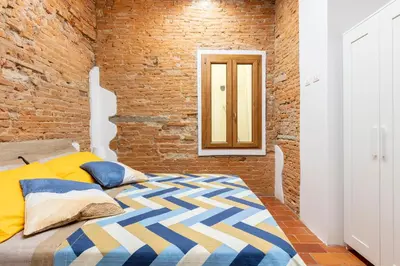 Letto o letti in una camera di Central cool apt S. Spirito, AC