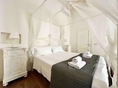 Letto o letti in una camera di Luxury apartment close to S. Frediano – Victor