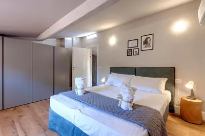 Letto o letti in una camera di Pepe Apartment by Mamo Florence