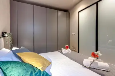 Letto o letti in una camera di Pepe Apartment by Mamo Florence