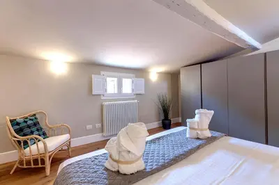 Letto o letti in una camera di Pepe Apartment by Mamo Florence