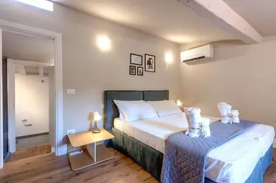 Letto o letti in una camera di Pepe Apartment by Mamo Florence