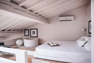 Letto o letti in una camera di Loft88- 2pax- Ponte Vecchio