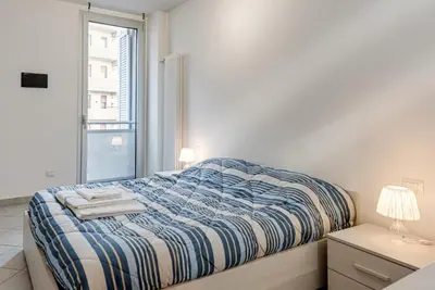 Letto o letti in una camera di Casa Roger Scandicci Centro Facile accesso a Firenze