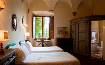 Letto o letti in una camera di Hotel Torre di Bellosguardo